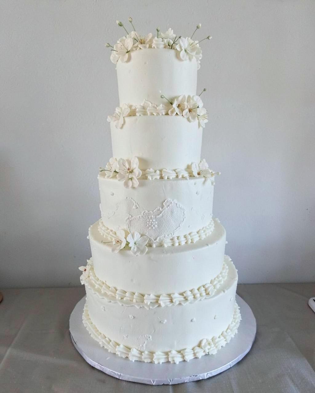 Three-tier white wedding cake